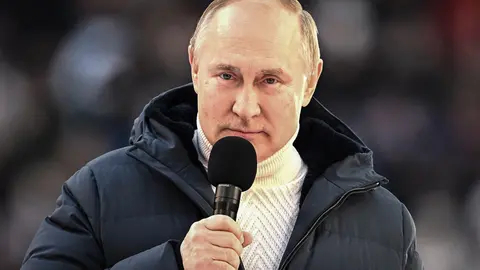 HANDOUT - 18 March 2022, Russia, Moscow: Russian President Vladimir Putin delivers a speech during a concert held to mark the eighth anniversary of Russia's annexation of Crimea at the Luzhniki stadium. Photo: -/Kremlin/dpa - ATTENTION: editorial use only and only if the credit mentioned above is referenced in full.