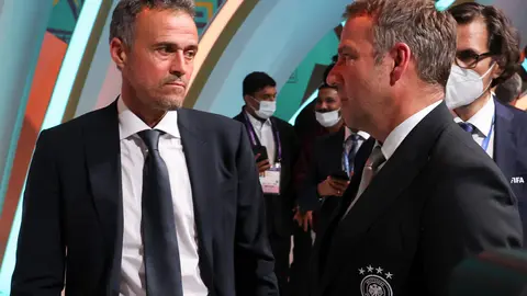 01 April 2022, Qatar, Doha: Germany's coach Hansi Flick (R) and Spain's coach Luis Enrique attend the FIFA World Cup Qatar 2022 Draw at the Doha Exhibition and Convention Center. Photo: Christian Charisius/dpa.