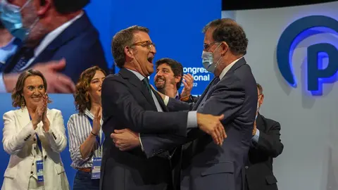 02 April 2022, Spain, Seville: Spanish former prime minister Mariano Rajoy greets newly-elected President of the Spanish conservative People's Party (PP), Alberto Nunez Feijoo, after th latter delivered a speech on the second and last day of the PP national congress. Photo: Eduardo Briones/EUROPA PRESS/dpa.