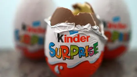 04 April 2022, United Kingdom, London: Three British variants of Kinder Surprise eggs are seen on a table. Due to more than 60 cases of salmonella illnesses in the UK, Ferrero has recalled some batches of children's surprise eggs just under two weeks before Easter. Photo: Victoria Jones/PA Wire/dpa.