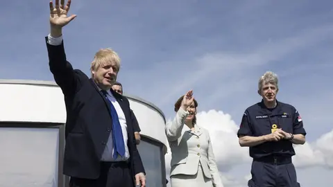 14 April 2022, United Kingdom, Kent: UK Prime Minister Boris Johnson, Dover member of parliament Natalie Elphicke and John Craig, Deputy Commander and Chief of Staff to the Commander of the UK Carrier Strike Group at Royal Navy, stand overlooking the channel in Dover. Photo: Dan Kitwood/PA Wire/dpa.
