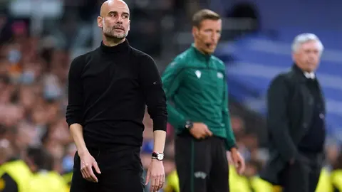 04 May 2022, Spain, Madrid: Manchester City manager Pep Guardiola (L) reacts from the touchlines during the UEFA Champions League semi final, second leg soccer match between Real Madrid and Manchester City at the Santiago Bernabeu. Photo: Nick Potts/PA Wire/dpa.