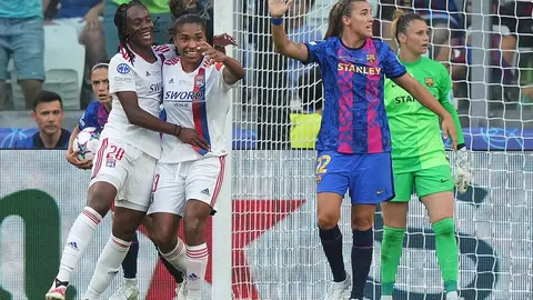 21 May 2022, Italy, Turin: Lyon's Catarina Macario (2nd L) celebrates scoring her side's second goal with teammate during the UEFA Women's Champions League final soccer match between Barcelona and Olympique Lyonnais at Allianz Stadium. Photo: -/LaPresse via ZUMA Press/dpa.