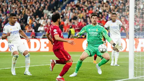 28 May 2022, France, Paris: Real Madrid's Thibaut Courtois saves from Liverpool's Mohamed Salah during the UEFA Champions League final soccer match between Liverpool FC and Real Madrid CF at the Stade de France. Photo: Nick Potts/PA Wire/dpa.