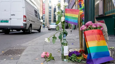 25 June 2022, Norway, Oslo: Pride flags can be seen tied to a mast after several shots were fired last night outside a nightclub. At least two people were killed and 21 injured in an incident the police are investigating whether it was related to terror. Photo: Terje Pedersen//dpa.