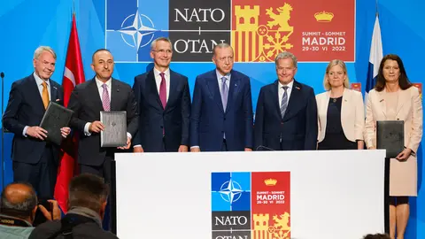 HANDOUT - 28 June 2022, Spain, Madrid: (L-R) Finnish Foreign Minister Pekka Haavisto, Turkish Foreign Minister Mevlut Cavusoglu, NATO Secretary General Jens Stoltenberg, Turkish President Recep Tayyip Erdogan, Finnish President Sauli Niinisto, Swedish Prime Minister Magdalena Andersson and Swedish Foreign Minister Ann Linde pose for a picture after signing a memorandum of joining of these Nordic countries to the defense alliance. Photo: -/NATO/dpa - ATTENTION: editorial use only and only if the credit mentioned above is referenced in full.