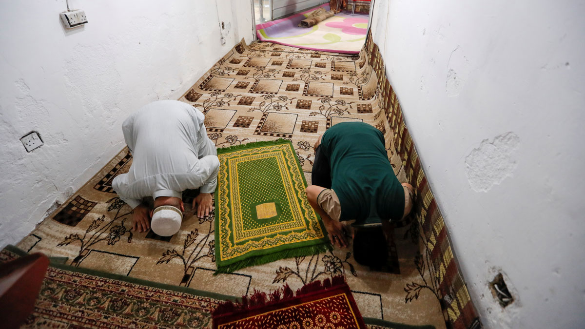 Iraqi-men-pray--in-Baghdad's-Adhamiya-district,-by--REUTERS-Thaier-Al-Sudani