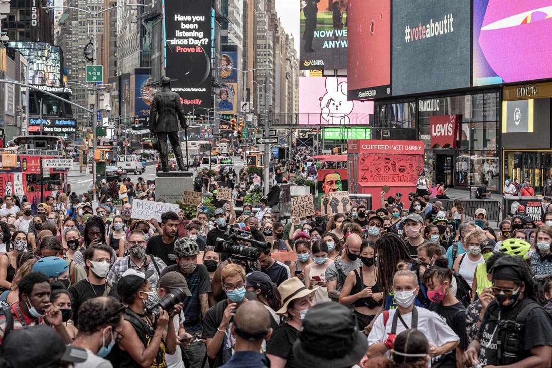 24 August 2020, US, New York: Protesters hold signs during a march at Time square following the shooting of Jacob Blake, an African-American man, by a white police officer. Photo: Corine Sciboz/dpa.