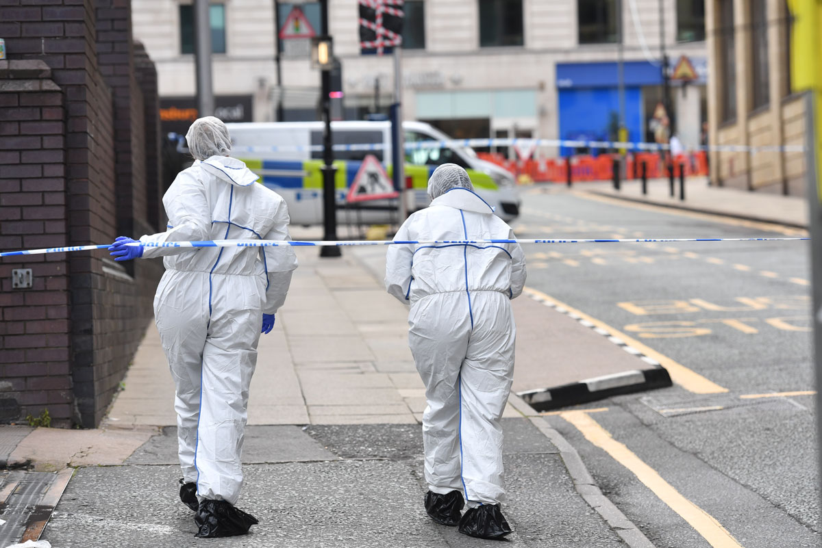 06 September 2020, England, Birmingham: Two police forensics officers enter the cordoned area on Livery Street in Birmingham after a number of people were stabbed in the city centre. West Midlands Police said they were called to reports of a stabbing at around 12.30am on Sunday and a number of other stabbings were reported in the area at around the same time. Photo: Jacob King/dpa.
