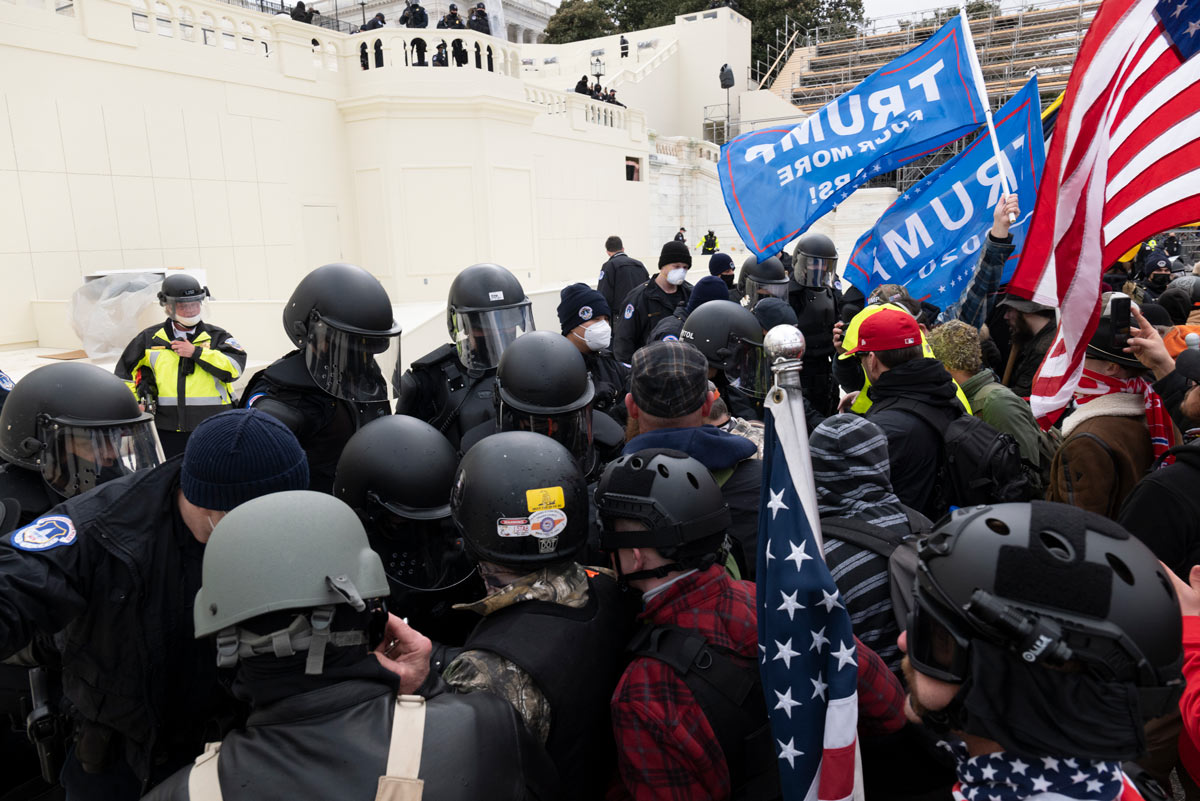06 January 2021, US, Washington: Police clash with supporters of US President Donald Trump as they storm the US Capitol building during a Congress session to affirm President-elect Joe Biden's victory. Pro-Trump protesters stormed the US Capitol Building to interrupt Congress session and protest the results of the US presidential election. Photo: Brian Branch Price/ZUMA Wire/dpa.