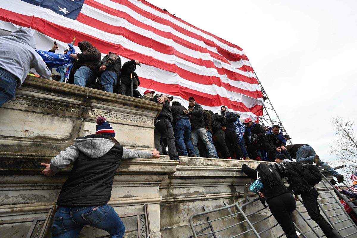06 January 2021, US, Washington: Supporters of US President Donald Trump storm the US Capitol building where lawmakers were due to certify president-elect Joe Biden's win in the November election. Photo: Essdras M. Suarez/dpa.
