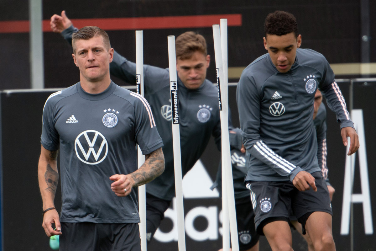 06 June 2021, Austria, Seefeld: (L-R) Germany's Toni Kroos, Joshua Kimmich and Jamal Musiala practice during a training session ahead of Monday's international friendly soccer match against Latvia, which held in preparation for the the UEFA EURO 2020 championship. Photo: Federico Gambarini/dpa