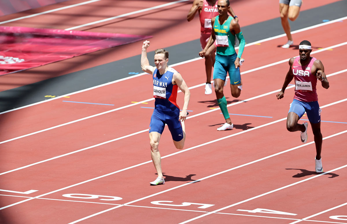 03 August 2021, Japan, Tokyo: Norway's Karsten Warholm (L) celebrates gold after finishing the Men's 400m Hurdles Final of the athletics competition at the Olympic Stadium during the Tokyo 2020 Olympic Games. Photo: Oliver Weiken/dpa