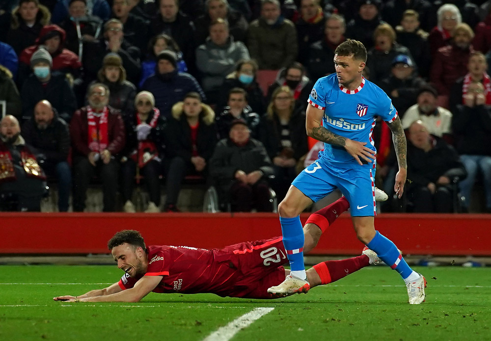 03 November 2021, United Kingdom, Liverpool: Atletico Madrid's Kieran Trippier (R) appears to foul Liverpool's Diogo Jota but nothing given during the UEFA Champions League Group B soccer match between Liverpool FC and Atletico Madrid at Anfield Stadium. Photo: Peter Byrne/PA Wire/dpa.