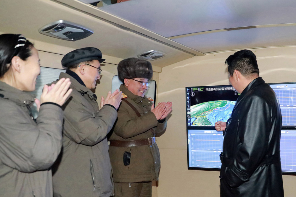 HANDOUT - 12 January 2022, North Korea, ---: A picture provided by the North Korean Central News Agency (KCNA) shows North Korean Leader Kim Jong-un (R) attending an early morning test firing of a hypersonic missile by the National Defense Academy of Sciences. Photo: -/KCNA/dpa.