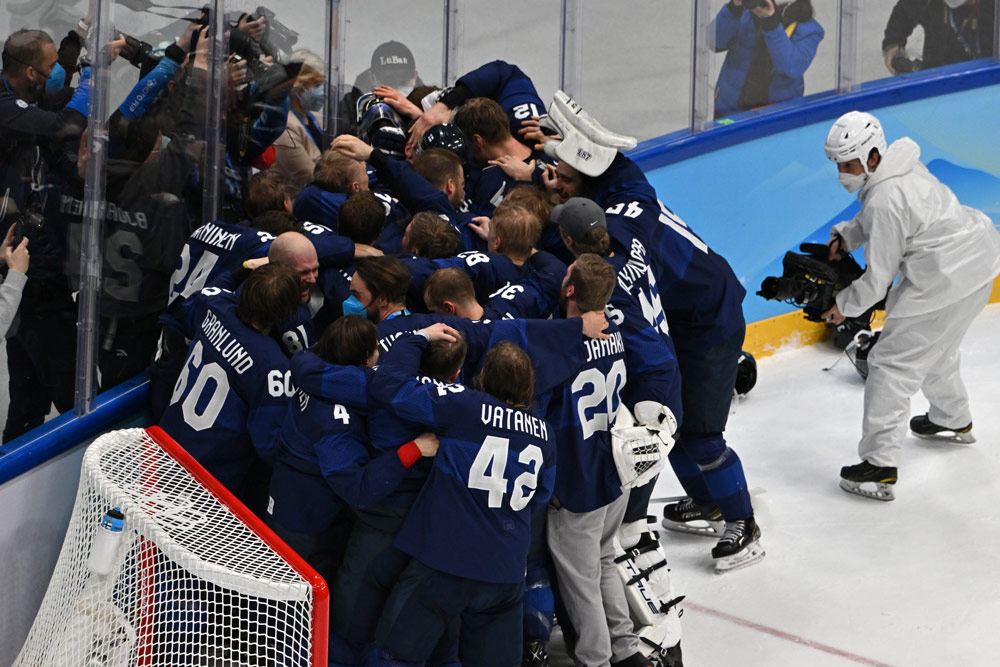 20 February 2022, China, Beijing: Finland players celebrate their victory after the Men's Ice Hockey Gold medal match between Finland and Russian Olympic Committee at Beijing National Indoor Stadium, during Beijing 2022 Winter Olympic Games. Photo: Peter Kneffel/dpa