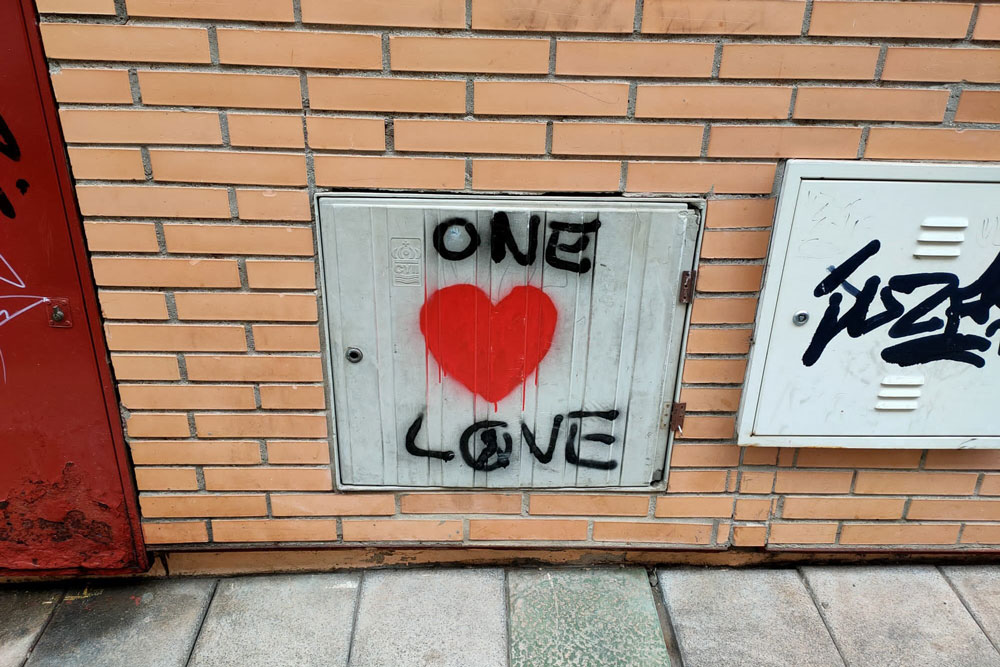 Red graffiti heart along with the legend One Love. Photo: Matthew Kennington.